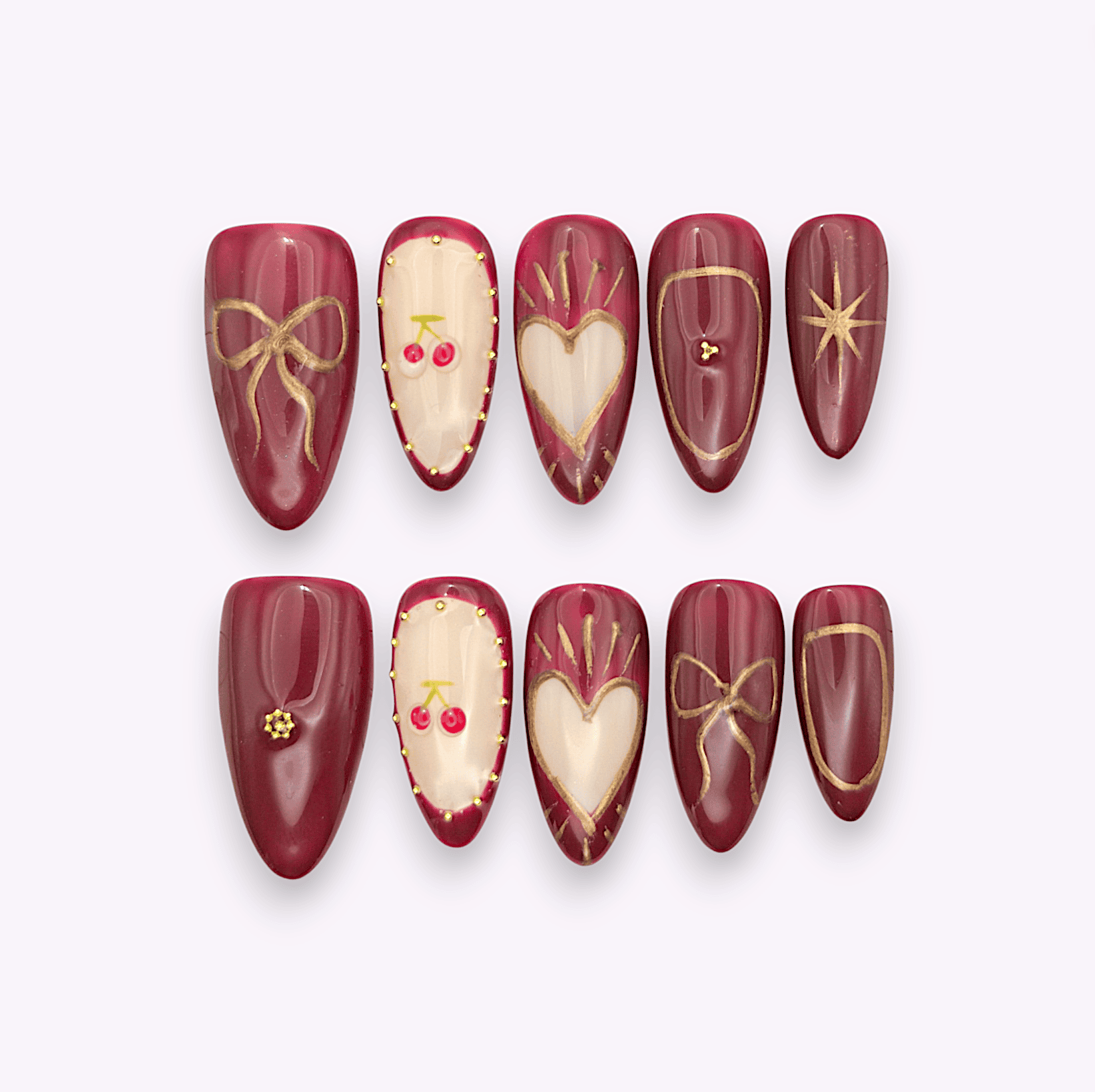 Press on nails amarena rosso ciliegia con dettagli oro e disegni